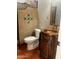 Bathroom featuring a toilet, decorative tile accents, and a custom vanity with copper sink at 25722 S 179Th St, Queen Creek, AZ 85142