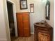 Inviting bathroom features a wood cabinet, a copper sink, and ample storage at 25722 S 179Th St, Queen Creek, AZ 85142