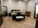 Spacious bedroom features hardwood floors, a queen bed, and ample natural light at 25722 S 179Th St, Queen Creek, AZ 85142