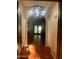 Inviting entryway with tile flooring, archway, chandelier, and views into the living area at 25722 S 179Th St, Queen Creek, AZ 85142