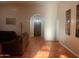 Spacious living room with tile flooring, comfortable seating, neutral colors, and a view of the entry at 25722 S 179Th St, Queen Creek, AZ 85142