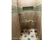 Detailed shower featuring decorative tile accents, a convenient built-in niche, and copper shower fixtures at 25722 S 179Th St, Queen Creek, AZ 85142
