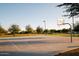 Outdoor basketball court with multiple hoops, perfect for recreational play and exercise at 2623 E Indigo Pl, Chandler, AZ 85286