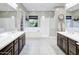 Spacious bathroom with dual vanities, a soaking tub, and a glass-enclosed shower at 2623 E Indigo Pl, Chandler, AZ 85286