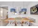 Bright dining room with modern pendant lights, bench seating, and table decor at 2623 E Indigo Pl, Chandler, AZ 85286