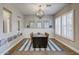 Stylish dining room featuring plantation shutters, modern lighting, and warm, inviting decor at 2623 E Indigo Pl, Chandler, AZ 85286