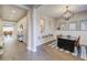 Bright dining room with hardwood floors, a modern chandelier, and access to an open floor plan at 2623 E Indigo Pl, Chandler, AZ 85286