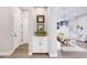 Entryway with built-in cabinet, decorative accents, and open view to the dining area at 2623 E Indigo Pl, Chandler, AZ 85286