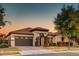 Beautiful single-Gathering home boasts mature trees, a tile roof, and an attached two-car garage at 2623 E Indigo Pl, Chandler, AZ 85286