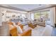 Open-concept living room featuring sofas, chairs, and access to a patio at 2623 E Indigo Pl, Chandler, AZ 85286