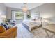 Inviting main bedroom with a large window, neutral decor, and seating area at 2623 E Indigo Pl, Chandler, AZ 85286
