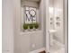 Powder room with pedestal sink, decorative wall accents, and minimalist design at 2623 E Indigo Pl, Chandler, AZ 85286