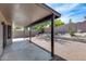 Desert backyard with cactus, rock landscaping and covered patio at 2730 E Desert Trumpet Rd, Phoenix, AZ 85048