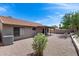 Spacious backyard featuring desert landscaping and a covered patio for outdoor enjoyment at 2730 E Desert Trumpet Rd, Phoenix, AZ 85048