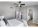 Bright bedroom showcases vaulted ceilings, a ceiling fan, and a convenient ensuite bathroom at 2730 E Desert Trumpet Rd, Phoenix, AZ 85048