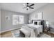 Cozy bedroom features a neutral palette, comfortable bed, and ample natural light from the window at 2730 E Desert Trumpet Rd, Phoenix, AZ 85048