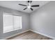 Bedroom with a modern ceiling fan, a window with blinds and neutral grey walls at 2730 E Desert Trumpet Rd, Phoenix, AZ 85048