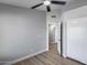 Bedroom with closet, modern ceiling fan and neutral grey walls at 2730 E Desert Trumpet Rd, Phoenix, AZ 85048