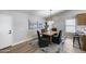 Elegant dining room with a modern chandelier, stylish decor, and a view of the open kitchen area at 2730 E Desert Trumpet Rd, Phoenix, AZ 85048