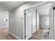 Bright hallway with neutral walls, wood-look flooring and arched entryways to other rooms at 2730 E Desert Trumpet Rd, Phoenix, AZ 85048