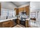 Bright kitchen with wood cabinets, stainless steel appliances, and white countertops at 2730 E Desert Trumpet Rd, Phoenix, AZ 85048