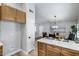 Open-concept kitchen with wood cabinets, island, and a view into the adjacent dining area at 2730 E Desert Trumpet Rd, Phoenix, AZ 85048