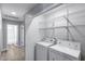 Practical laundry area with washer, dryer and shelving for storage at 2730 E Desert Trumpet Rd, Phoenix, AZ 85048