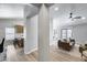 Open-concept floor plan featuring a spacious living room with wood floors, adjacent to a modern kitchen with a breakfast bar at 2730 E Desert Trumpet Rd, Phoenix, AZ 85048
