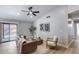 Inviting living room features a modern ceiling fan, neutral walls and access to the backyard at 2730 E Desert Trumpet Rd, Phoenix, AZ 85048