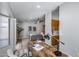 Open-concept living room with hardwood floors, modern décor, and a glimpse into the kitchen at 2730 E Desert Trumpet Rd, Phoenix, AZ 85048