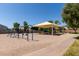 Community playground featuring swings, slides, and a shaded picnic area for Gathering fun at 2730 E Desert Trumpet Rd, Phoenix, AZ 85048