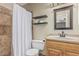 Cozy bathroom with a shower, decorative shelves and wood-framed mirror at 3030 S Rogers --, Mesa, AZ 85202