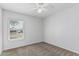A cozy bedroom featuring neutral carpet, a ceiling fan, and a sunlit window at 3030 S Rogers --, Mesa, AZ 85202