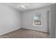 Cozy bedroom featuring a ceiling fan, carpet flooring, and a window offering a serene space to relax at 3030 S Rogers --, Mesa, AZ 85202