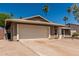 Single story home with two-car garage, desert landscaping, and desert-toned exterior paint at 3030 S Rogers --, Mesa, AZ 85202