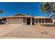 Single story home with two-car garage, desert landscaping, and desert-toned exterior paint at 3030 S Rogers --, Mesa, AZ 85202