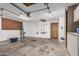 Spacious garage featuring concrete floors, ample storage, and multiple access points at 3030 S Rogers --, Mesa, AZ 85202