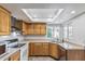 Well-lit kitchen with stainless steel appliances and a skylight providing ample natural light at 3030 S Rogers --, Mesa, AZ 85202