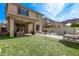 Lush backyard featuring a pool, patio area, and manicured green space at 3128 E Tina Dr, Phoenix, AZ 85050