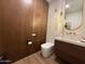 Modern powder room features sleek vanity, stylish lighting, and contemporary design at 3128 E Tina Dr, Phoenix, AZ 85050