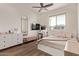 Bright bedroom featuring a makeup vanity, ample natural light, and neutral decor at 3128 E Tina Dr, Phoenix, AZ 85050