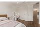 Bedroom with wood floors, built-in vanity, and closet with sliding doors at 3128 E Tina Dr, Phoenix, AZ 85050
