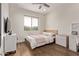 Bright bedroom with hardwood floors, a large window, and modern furnishings at 3128 E Tina Dr, Phoenix, AZ 85050