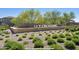 Landscaped entrance sign for Sky Crossing community with lush greenery and manicured landscaping at 3128 E Tina Dr, Phoenix, AZ 85050