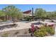 Well-kept community park with flowering bushes, trees, walkways and playground at 3128 E Tina Dr, Phoenix, AZ 85050