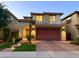 Inviting two-story home with warm exterior lighting, a well-maintained yard, and a spacious driveway at 3128 E Tina Dr, Phoenix, AZ 85050