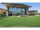 Community center with open lawn area, outdoor seating, modern design, and a grand facade at 3128 E Tina Dr, Phoenix, AZ 85050