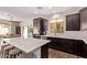 Stylish kitchen features dark cabinetry, white countertops, and open design at 3128 E Tina Dr, Phoenix, AZ 85050