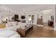 Open-concept living room showcases modern design, flowing into kitchen and dining areas at 3128 E Tina Dr, Phoenix, AZ 85050