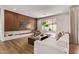 Bright living room featuring modern fireplace, wood accent wall and stylish furnishings at 3128 E Tina Dr, Phoenix, AZ 85050